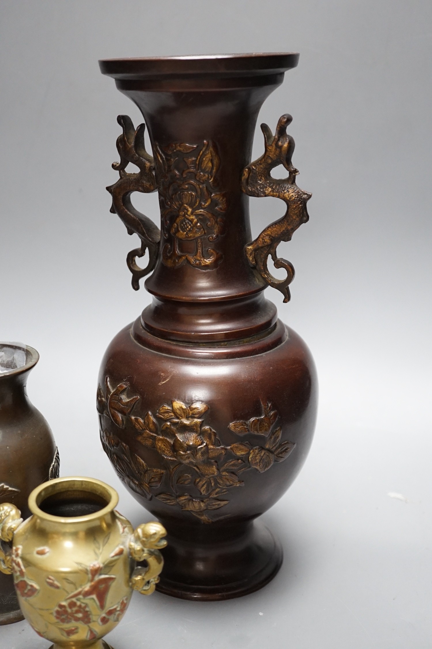 A group of Japanese bronze and mixed metal vases and a plated sugar castor, tallest 30cm